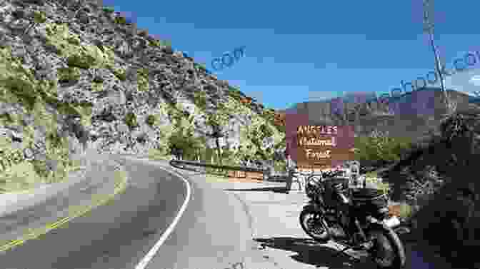 A Motorcycle Rider Navigating The Winding Curves Of Angeles Crest Highway, Surrounded By Lush Forests And Towering Mountains. Motorcycle Routes Around Los Angeles