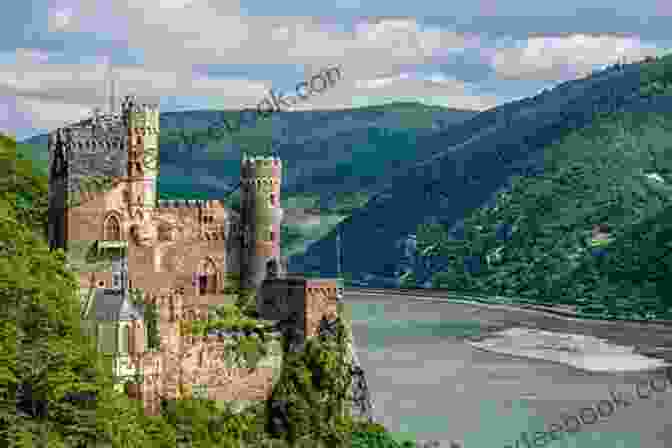 Panoramic View Of The Rhine River Valley, With Lush Green Hillsides And Medieval Castles Perched On Hilltops Cruising The Canals Rivers Of Germany